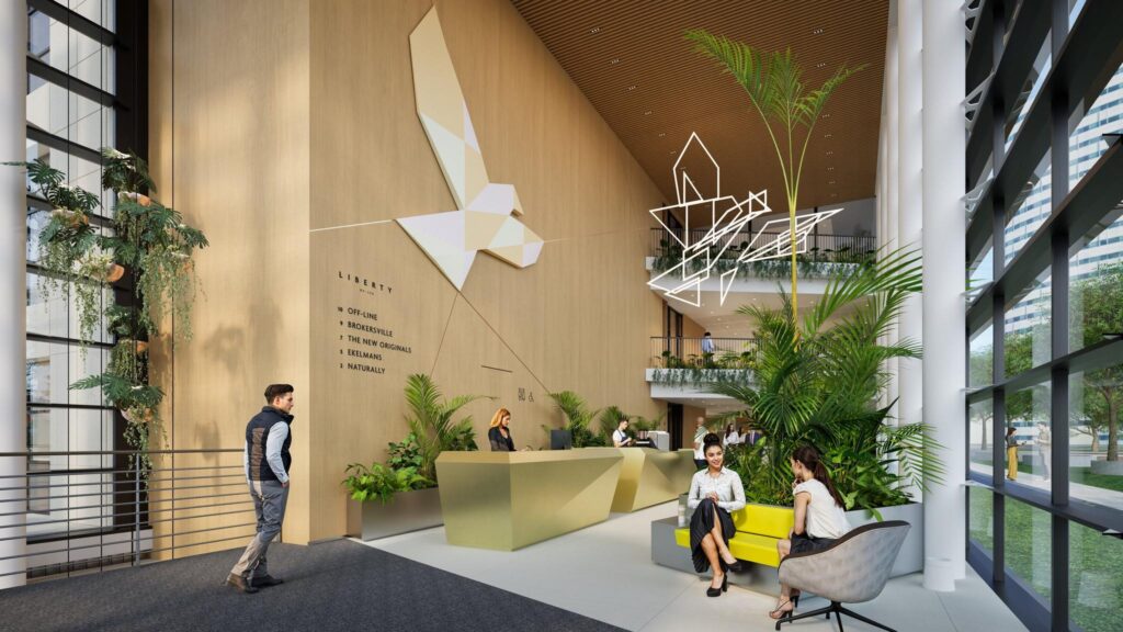 Modern office lobby of Liberty building with green accents, seating area, and reception desk.